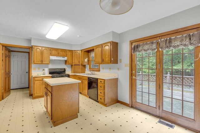 kitchen featuring a center island, sink, and black appliances