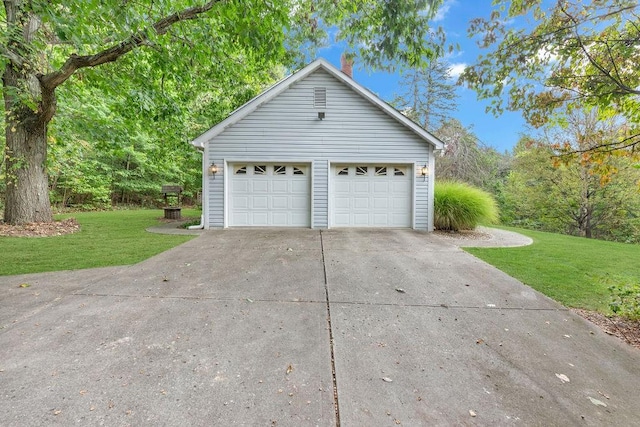 garage with a yard