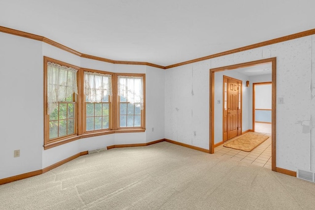 carpeted empty room with crown molding