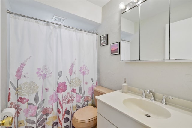 bathroom featuring vanity, toilet, and a shower with shower curtain