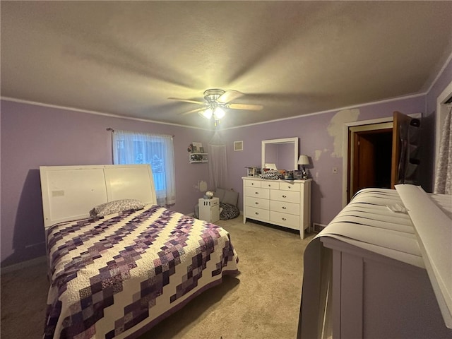 bedroom featuring light carpet, crown molding, and ceiling fan