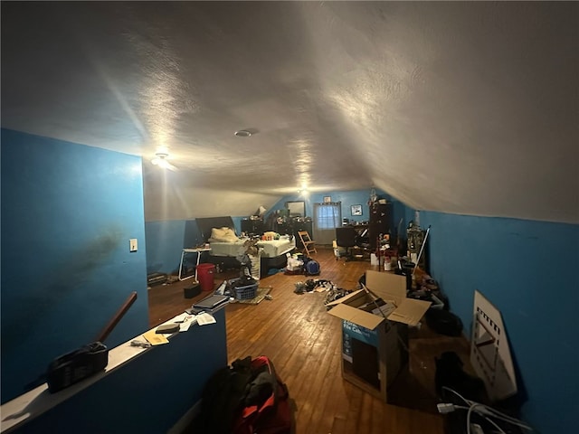 bonus room featuring lofted ceiling and wood-type flooring