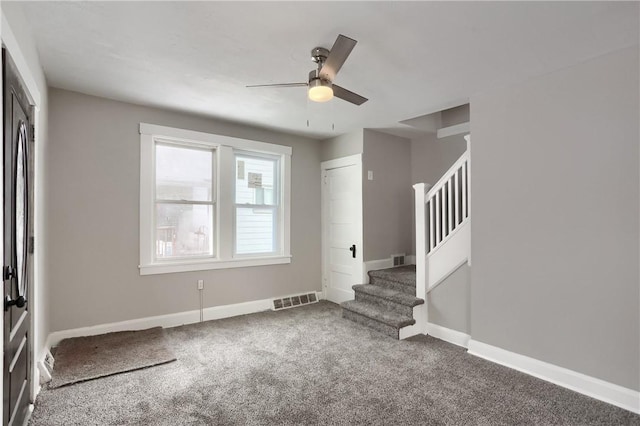 interior space featuring ceiling fan