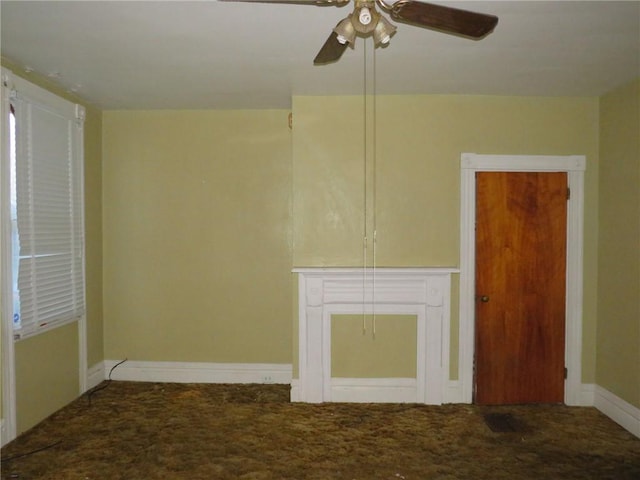 carpeted empty room with ceiling fan