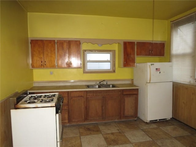 kitchen featuring sink and white appliances