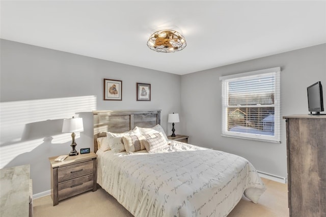 bedroom featuring light carpet