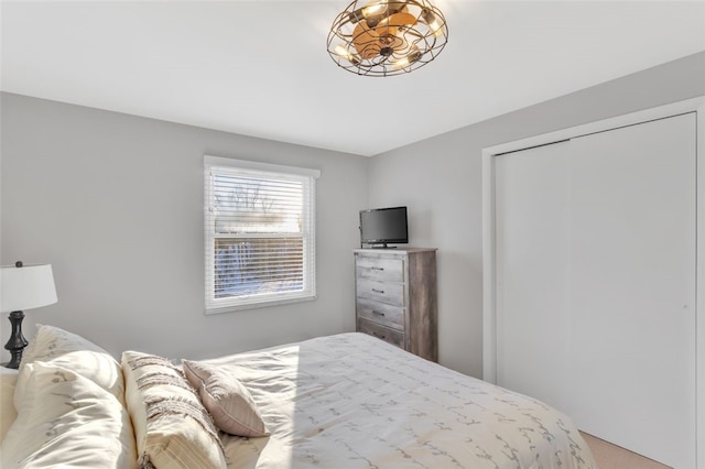 carpeted bedroom with a closet