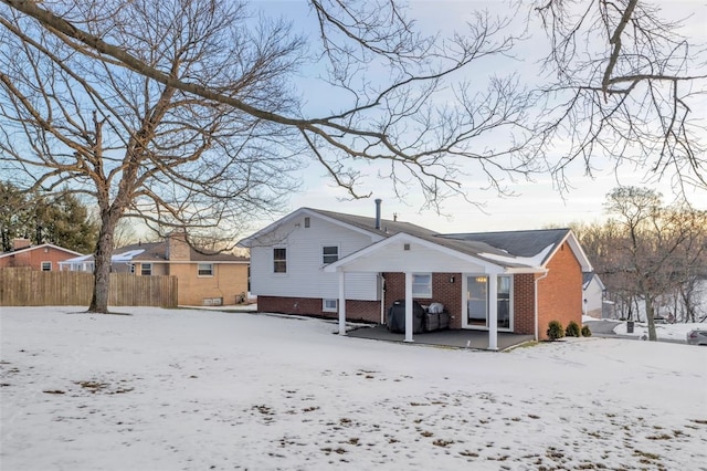 view of snow covered house