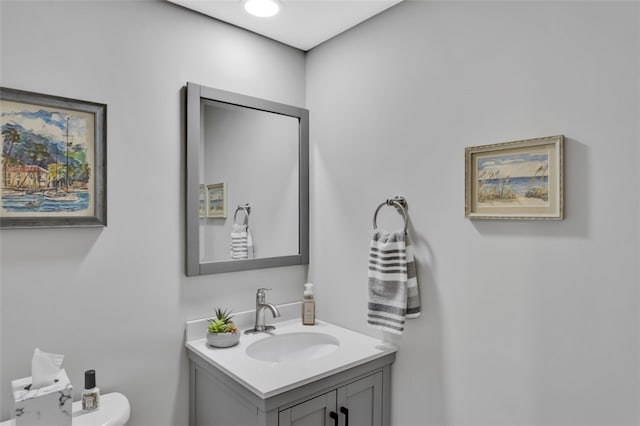 bathroom with vanity and toilet