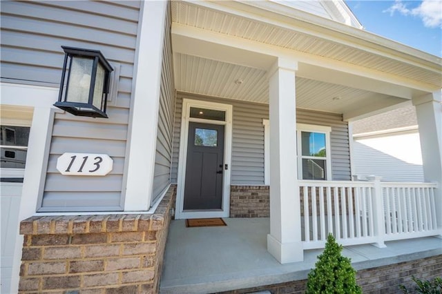 entrance to property with a porch