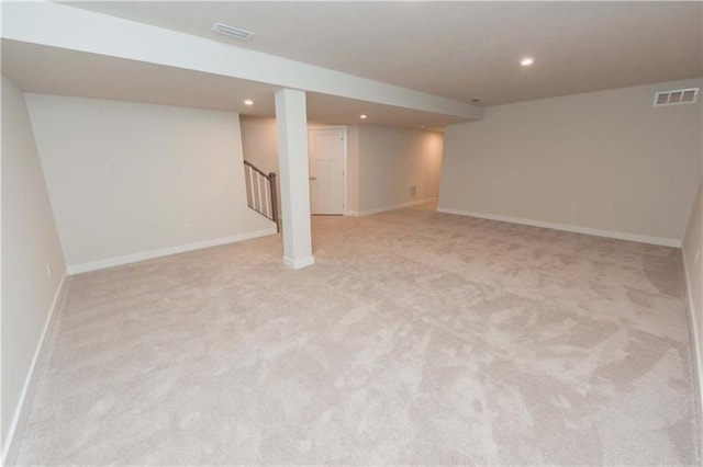 basement with light colored carpet