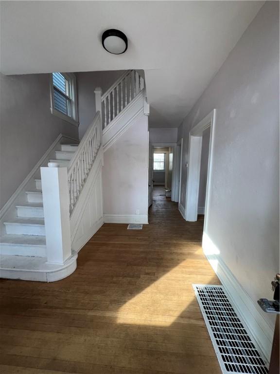 staircase featuring hardwood / wood-style flooring