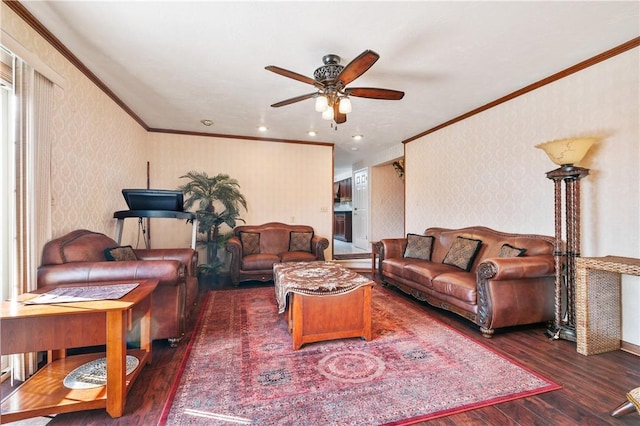 living room with crown molding, dark hardwood / wood-style floors, and ceiling fan