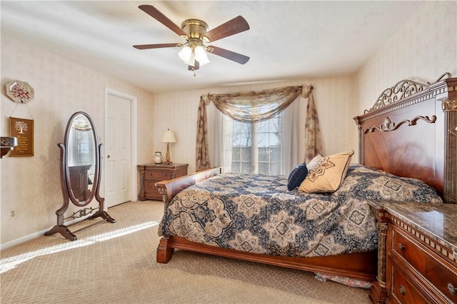 bedroom with ceiling fan and light carpet