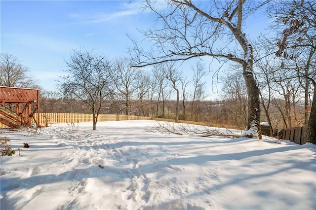 view of yard layered in snow