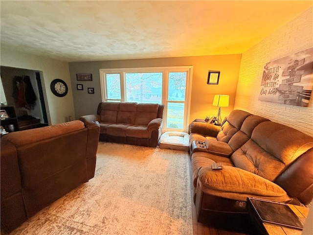 living room with brick wall