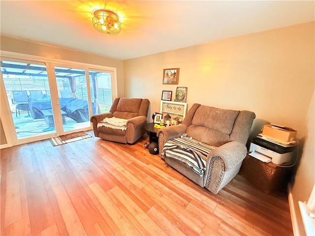 sitting room with hardwood / wood-style floors