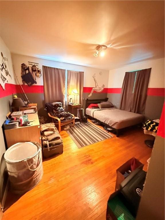 bedroom featuring wood-type flooring