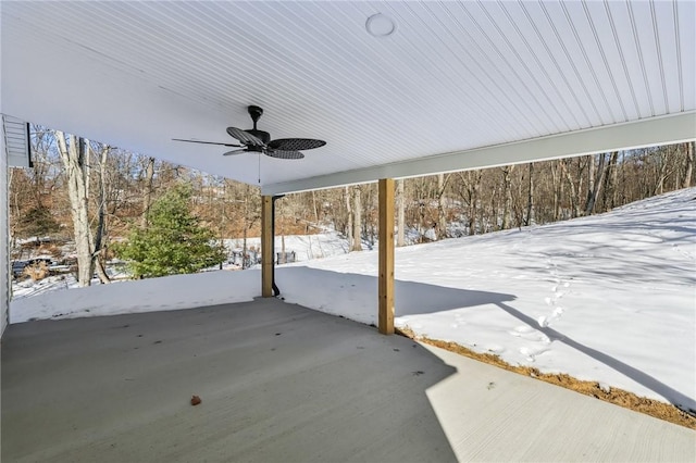 snow covered patio featuring ceiling fan