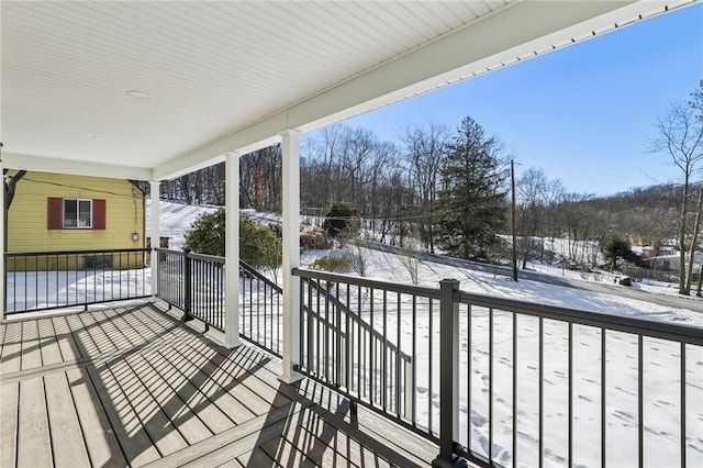 view of snow covered deck