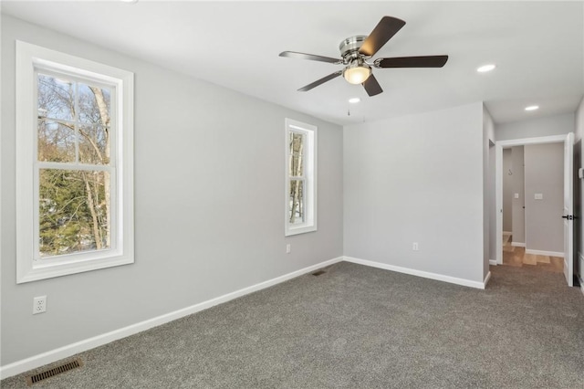 interior space featuring carpet floors and ceiling fan