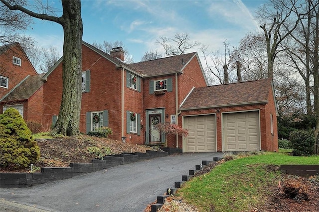 1722 Arlington Rd, Blackridge, PA 15235 - view of front of property with brick siding, an attached garage, a chimney, and driveway