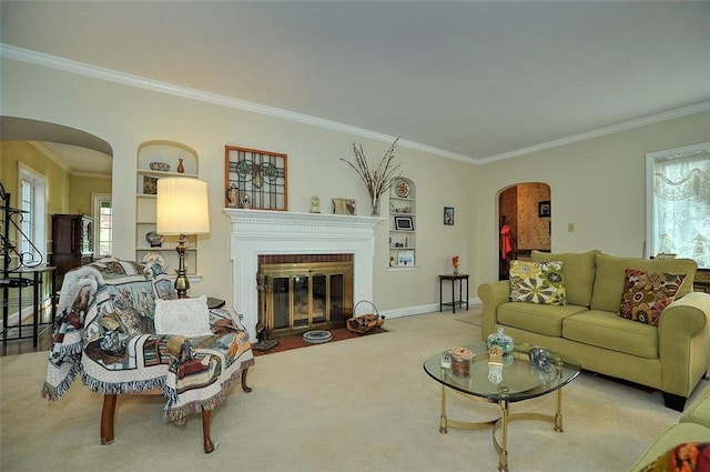 carpeted living room featuring a fireplace with flush hearth, baseboards, arched walkways, and ornamental molding