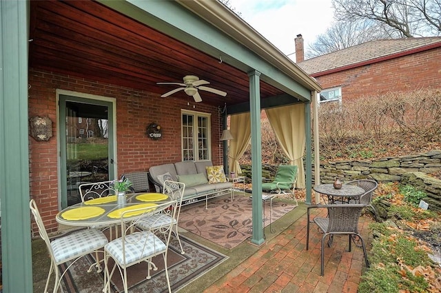 view of patio with outdoor lounge area and ceiling fan