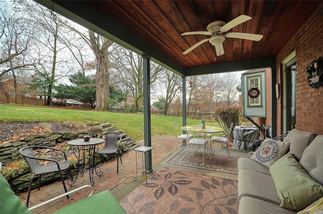 view of patio / terrace featuring outdoor dining space, an outdoor living space, fence, and ceiling fan