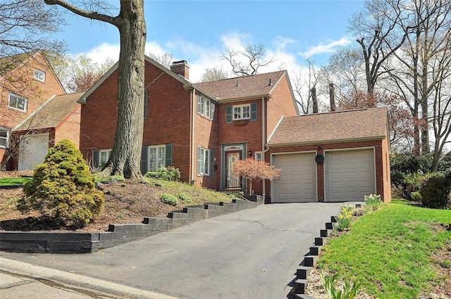 1722 Arlington Rd, Blackridge, PA 15235 - view of front of home with roof with shingles, driveway, a chimney, brick siding, and an attached garage