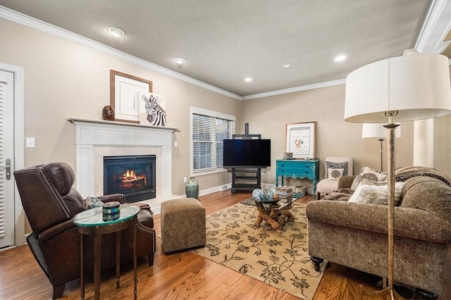 living room featuring wood-type flooring and ornamental molding