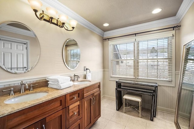 bathroom with vanity, crown molding, and tile patterned floors