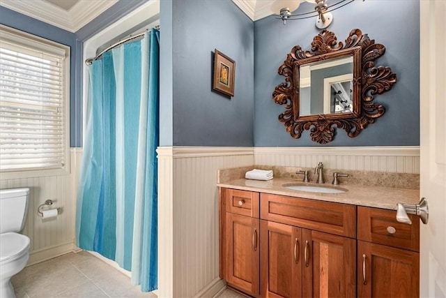 bathroom with tile patterned floors, toilet, crown molding, a shower with curtain, and vanity