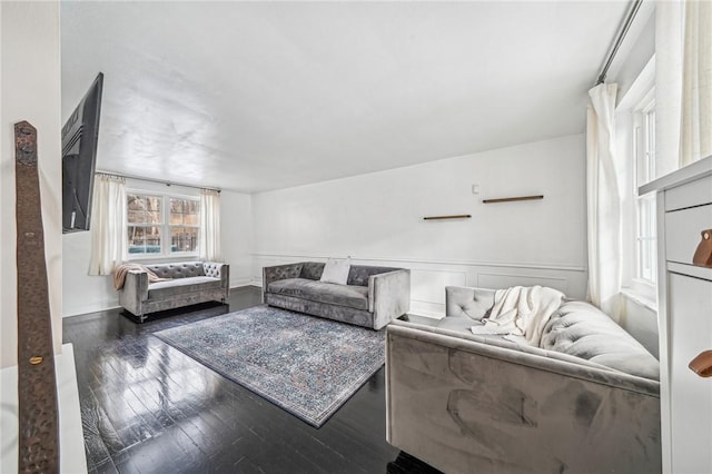 living room with dark hardwood / wood-style flooring