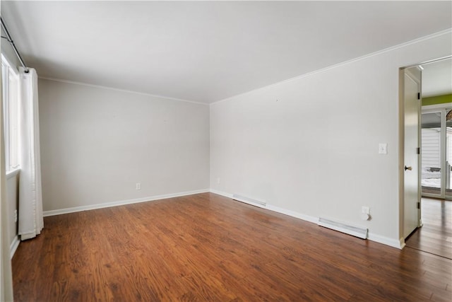 unfurnished room with dark hardwood / wood-style flooring