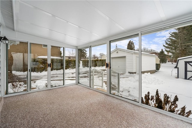 unfurnished sunroom with vaulted ceiling