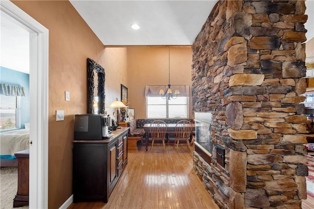 interior space with a chandelier and light hardwood / wood-style flooring