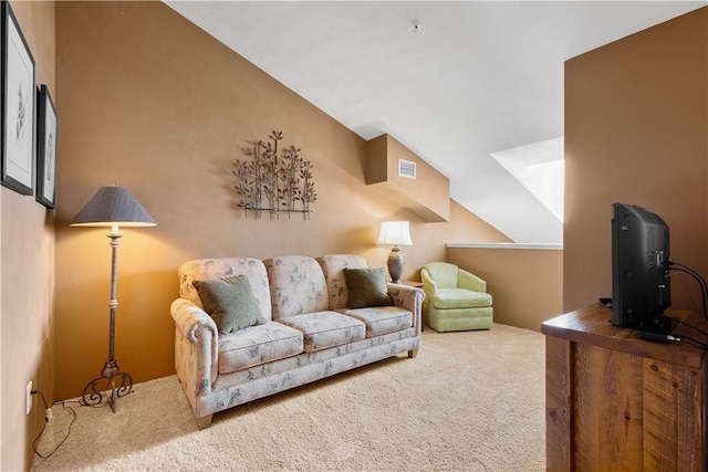 living room with carpet floors and vaulted ceiling