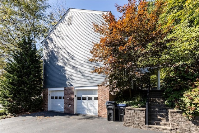 view of property exterior with a garage