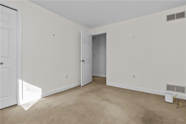 unfurnished bedroom with light carpet