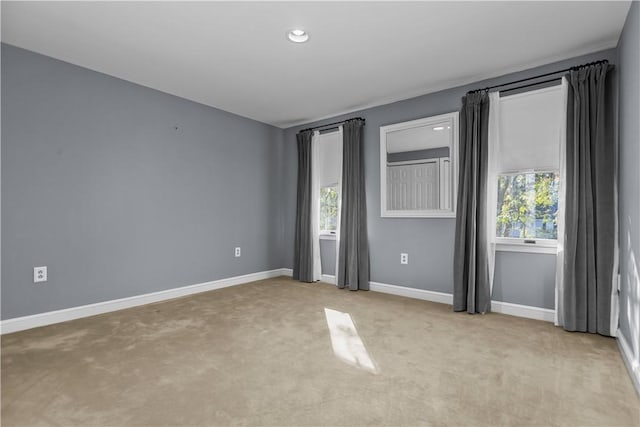 unfurnished bedroom with light carpet