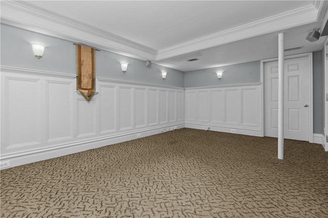 basement with ornamental molding and carpet flooring