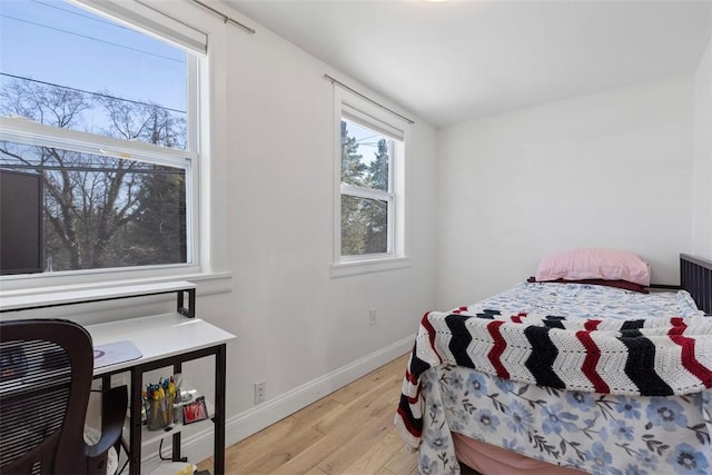 bedroom with light hardwood / wood-style floors