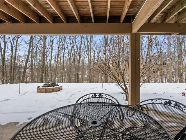 exterior space featuring an outdoor fire pit