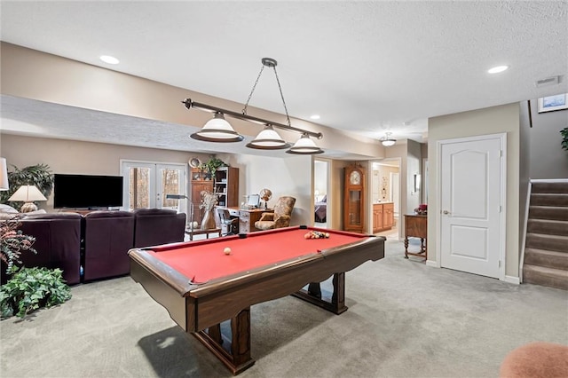 playroom with french doors, billiards, light carpet, and a textured ceiling