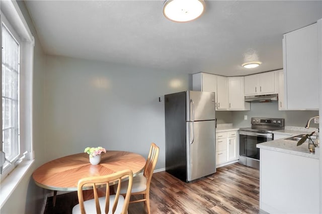 kitchen featuring white cabinetry, appliances with stainless steel finishes, sink, and dark hardwood / wood-style flooring