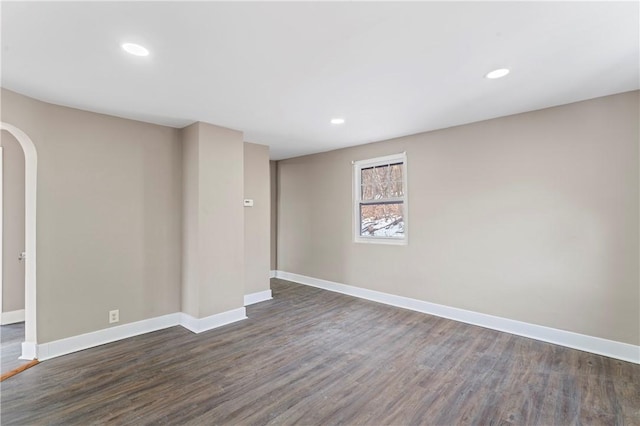 empty room with dark wood-type flooring