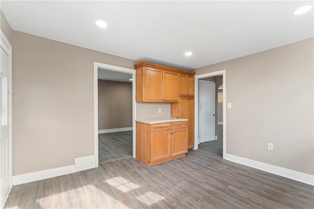 kitchen with dark hardwood / wood-style floors