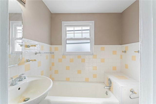 bathroom featuring sink and a bathtub