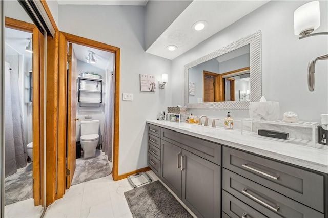 bathroom with vanity and toilet